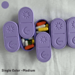 A medium-sized 3D printed weekly pill organizer displayed in one solid color. The larger pill compartments fit vitamins, supplements, and multiple daily pills. Each sliding lid includes an engraved sun icon and weekday label. Shown neatly arranged to highlight the smooth print finish, ergonomic curves, and increased storage capacity of the medium size.