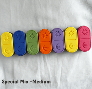 A colorful 3D printed weekly pill box featuring a full rainbow-style special mix, with each sliding lid in a different vibrant color. Perfect for users who want a cheerful, easy-to-identify medication organizer. The image shows seven pill containers with engraved weekday labels arranged neatly to showcase the rainbow theme and large pill capacity.