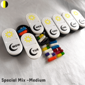 A medium-sized 3D printed weekly pill box set in a special mix color combination, featuring vibrant custom lids such as yellow sun-and-moon patterns, turquoise, pink, or multicolor styles. The photo highlights the unique color blend chosen by the customer, with engraved weekday labels and smooth sliding lids. Ideal for gifting, chronic illness management, or adding fun to medication routines.