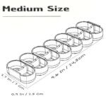 Monochrome CAD-style illustration of the Medium Size 3D-printed weekly pill organizer with seven compartments. Dimensions included: 9.6 inches (24.5 cm) length, 2.7 inches (7 cm) width, and 0.9 inches (2.5 cm) height. Image highlights internal structure, sliding-lid guides, and medium capacity suitable for daily vitamins and supplements.